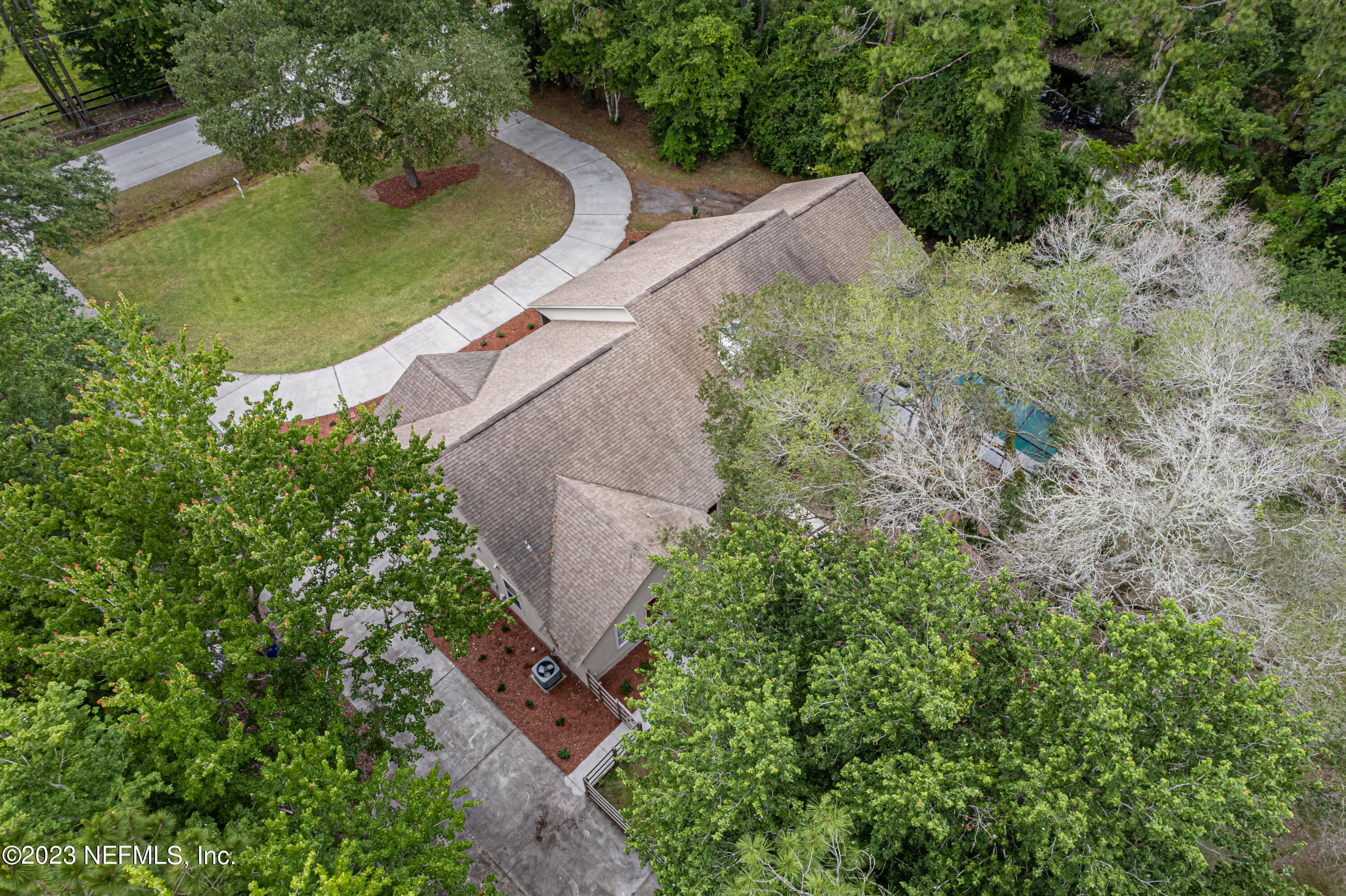 1193 Marlee Road St. Johns, FL 32259 - Photo 54 of 63 an aerial view of a house with a yard and trees