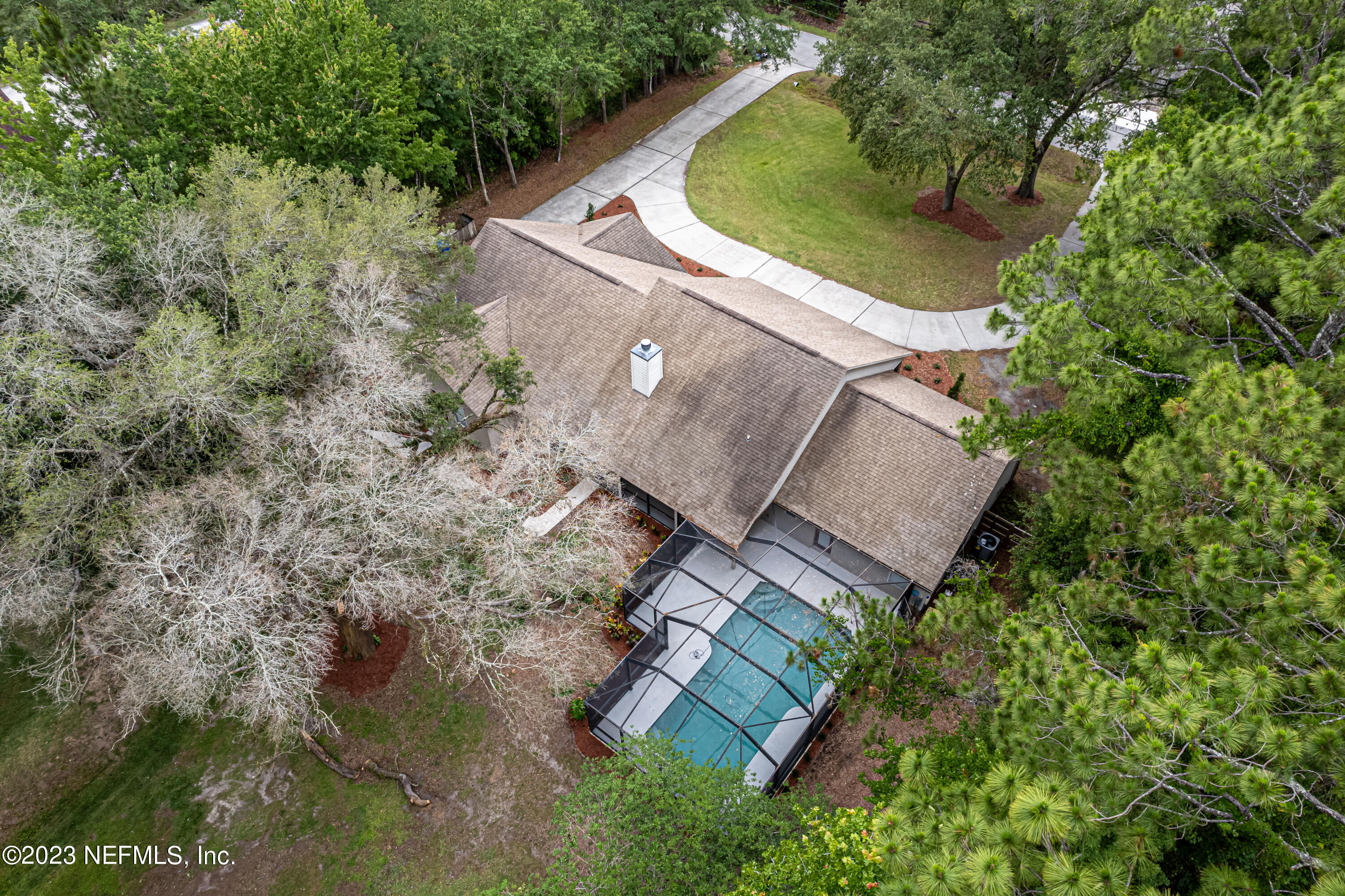 1193 Marlee Road St. Johns, FL 32259 - Photo 56 of 63 an aerial view of a house with a yard and trees all around