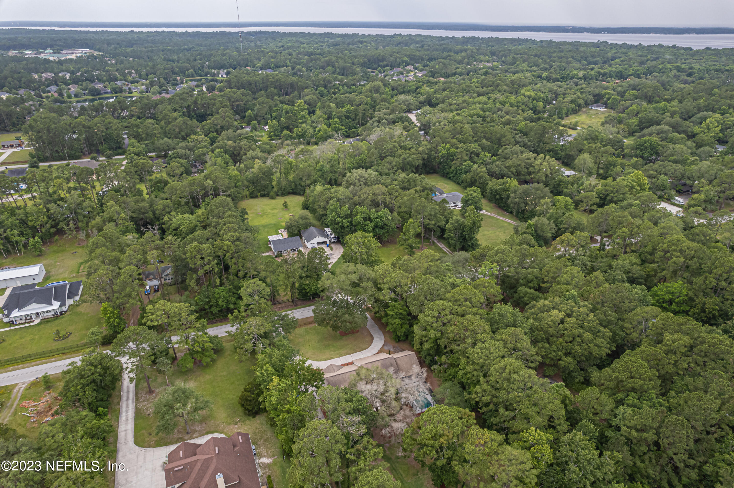 1193 Marlee Road St. Johns, FL 32259 - Photo 60 of 63 an aerial view of residential houses with outdoor space and trees