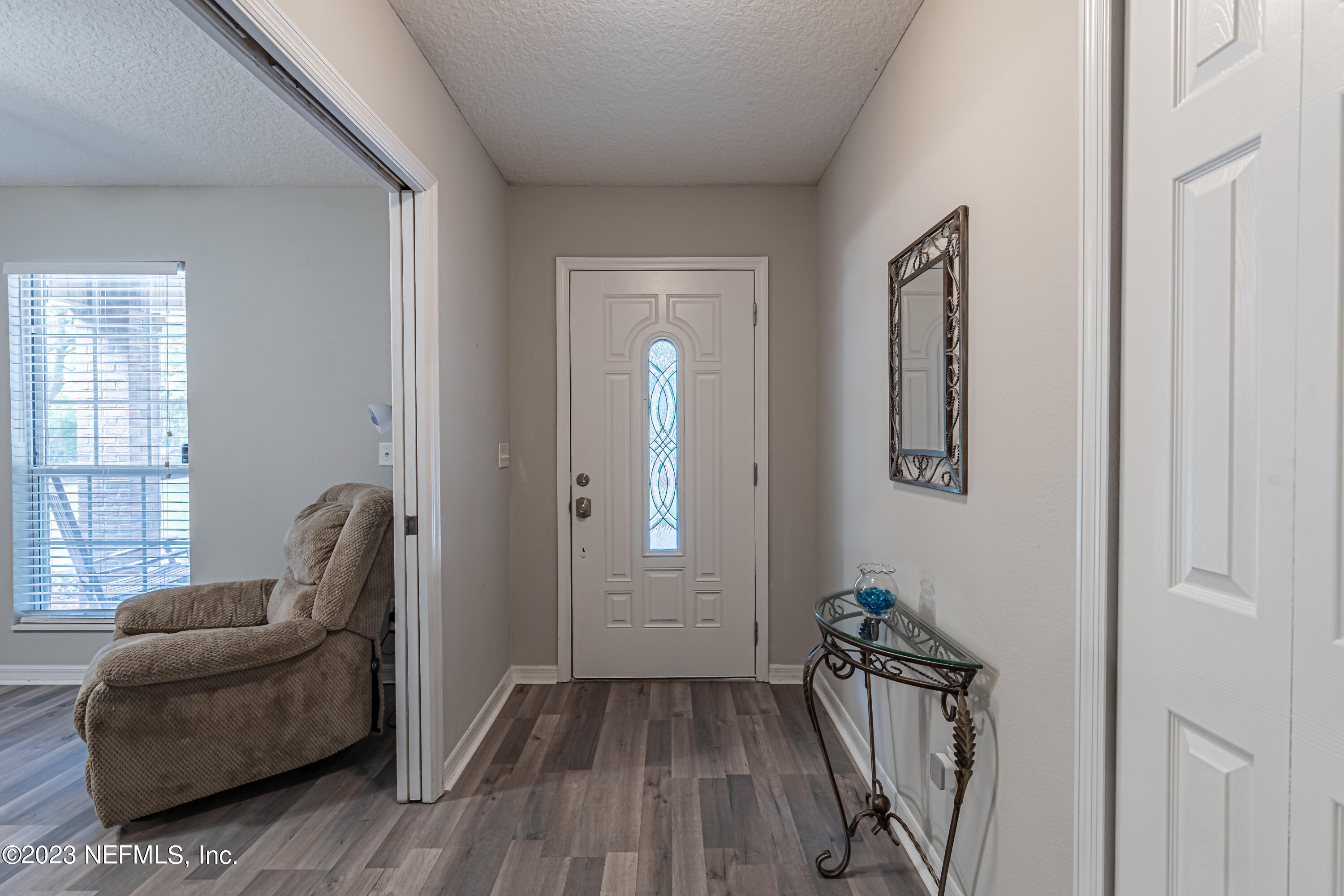 1193 Marlee Road St. Johns, FL 32259 - Photo 6 of 63 a hallway with couches and wooden floor