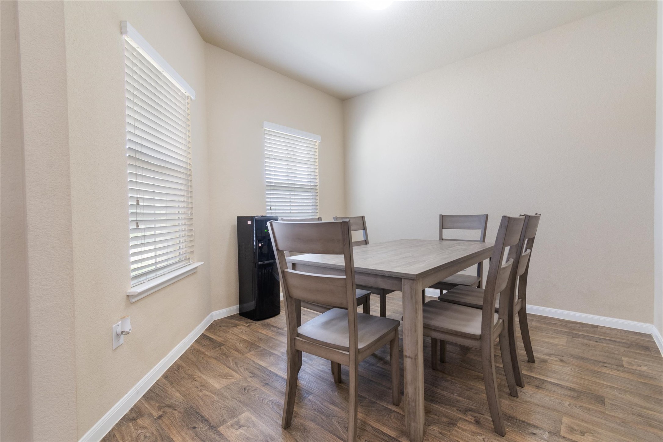11620 Carbrook Road Manor, TX 78653 - Photo 12 of 40 a view of a dining room with furniture and wooden floor
