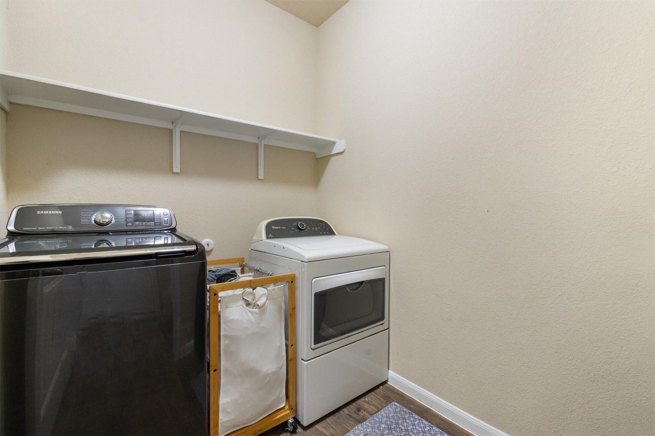11620 Carbrook Road Manor, TX 78653 - Photo 16 of 40 a utility room with dryer and washer