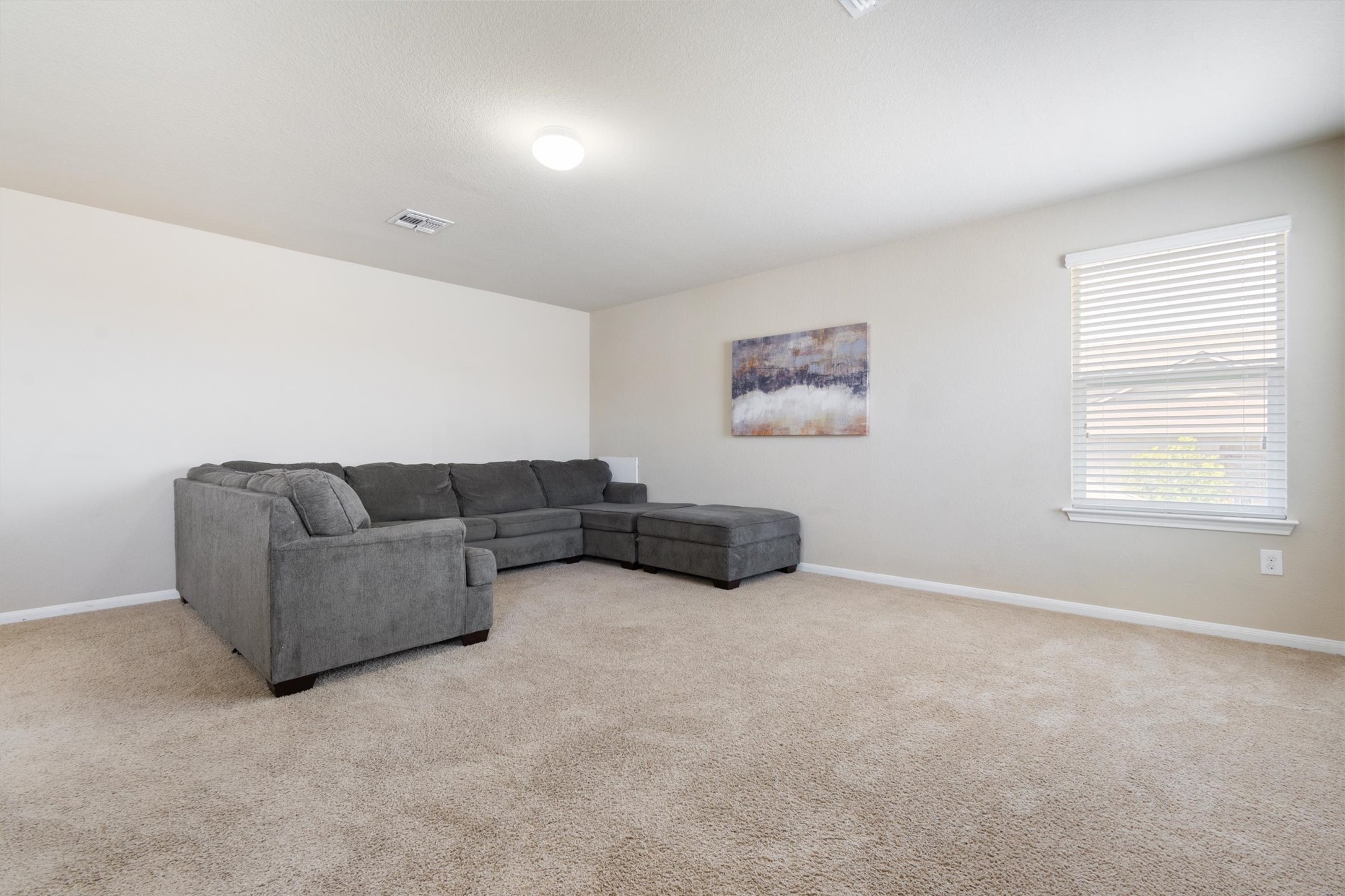 11620 Carbrook Road Manor, TX 78653 - Photo 27 of 40 a living room with furniture and a window