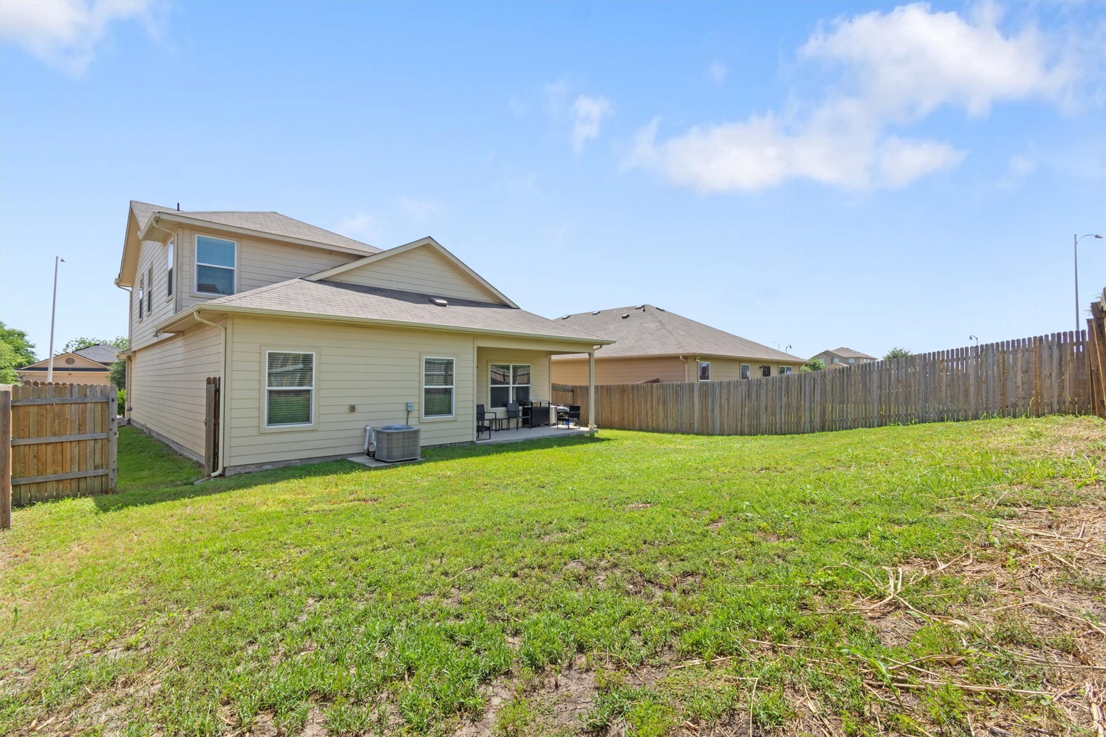 11620 Carbrook Road Manor, TX 78653 - Photo 31 of 40 a view of a house with a yard and sitting area
