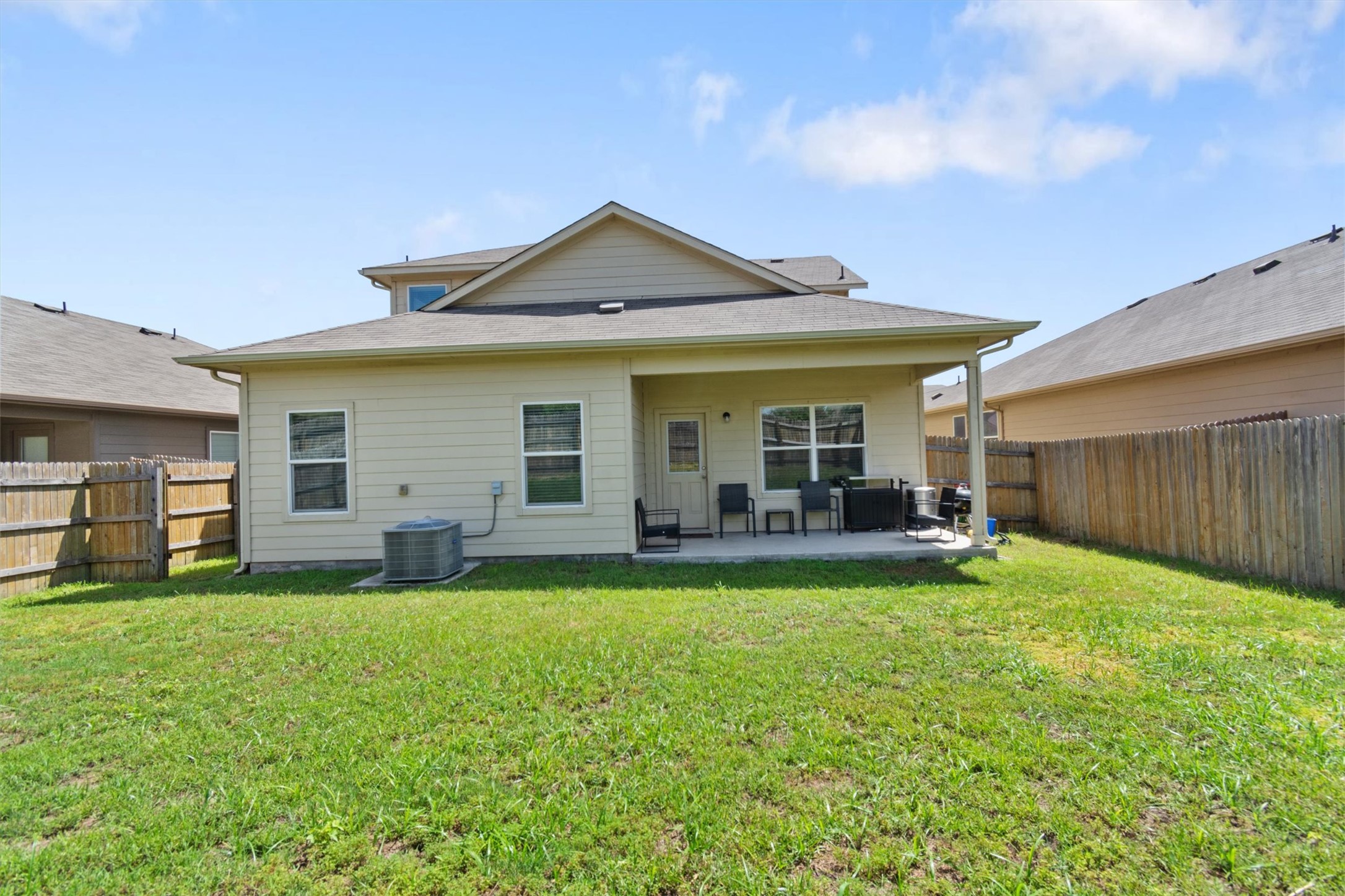11620 Carbrook Road Manor, TX 78653 - Photo 33 of 40 a view of a house with a yard and sitting area