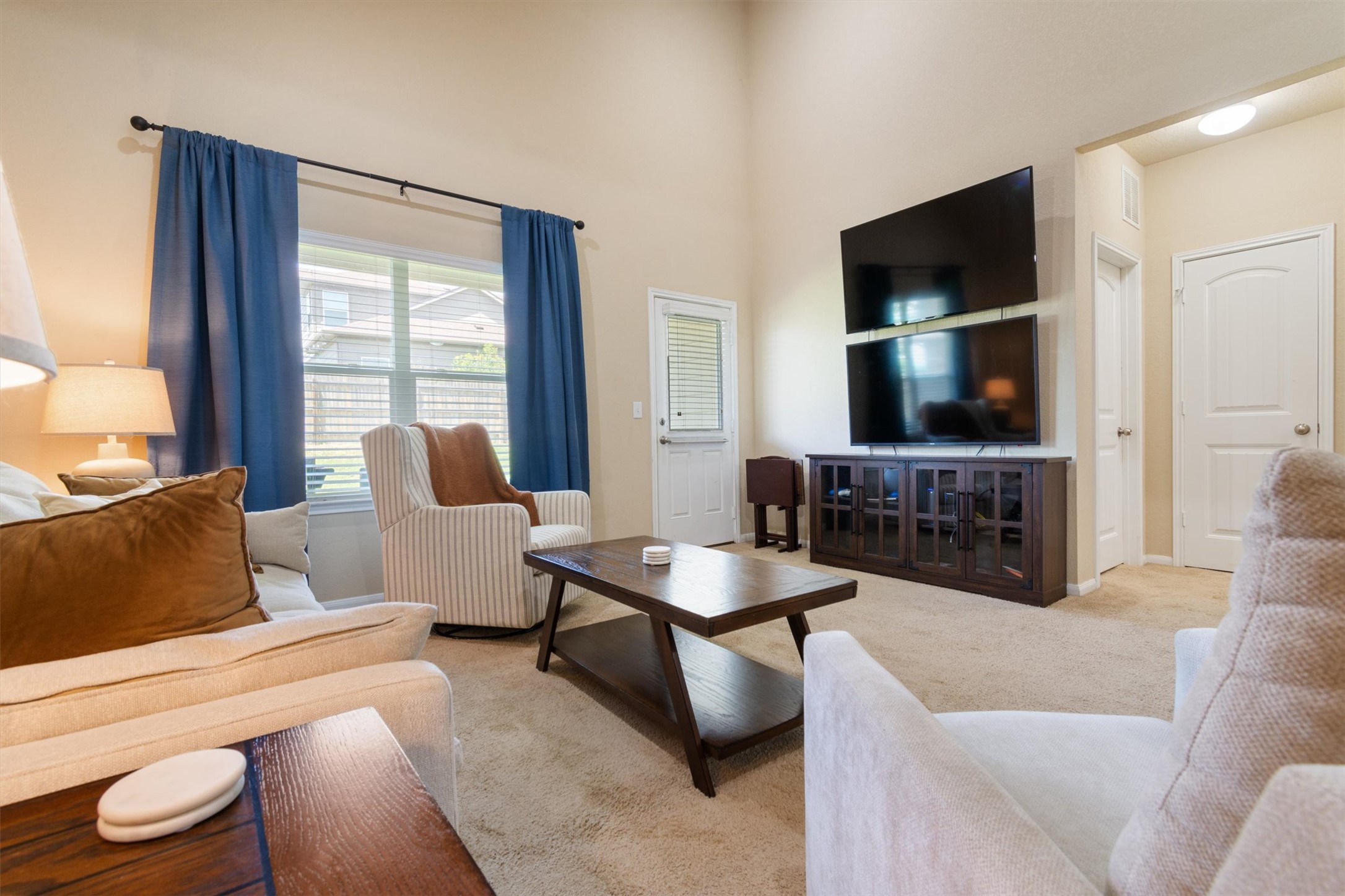 11620 Carbrook Road Manor, TX 78653 - Photo 7 of 40 a living room with furniture and a flat screen tv