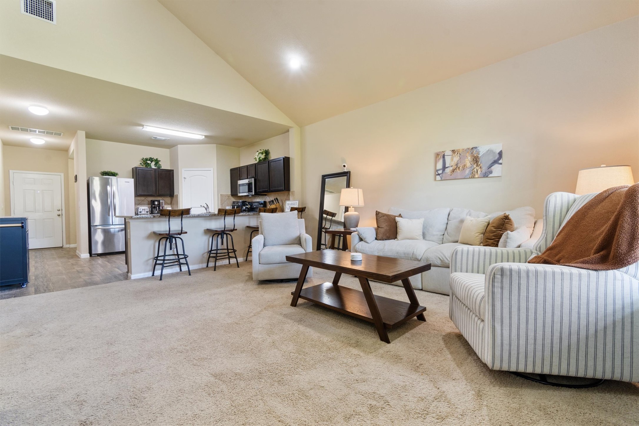 11620 Carbrook Road Manor, TX 78653 - Photo 9 of 40 a living room with furniture and a flat screen tv