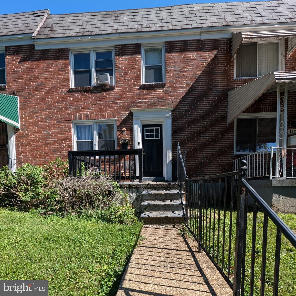 4219 Colborne Road Baltimore, MD 21229 - Photo 1 of 22 a view of a house with wooden floor and a small yard