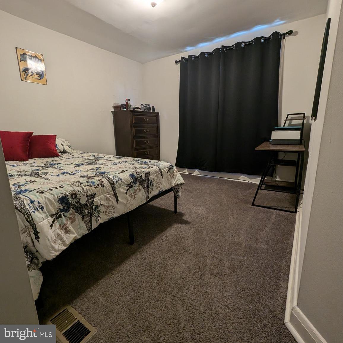 4219 Colborne Road Baltimore, MD 21229 - Photo 11 of 22 a bedroom with a bed and a dresser