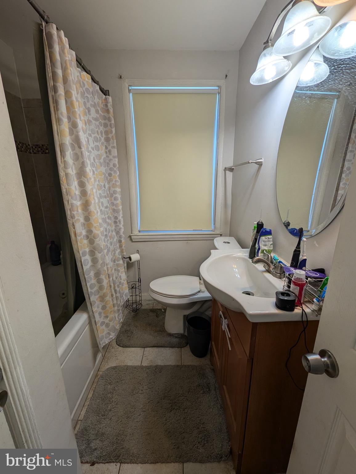 4219 Colborne Road Baltimore, MD 21229 - Photo 17 of 22 a bathroom with a sink toilet and shower