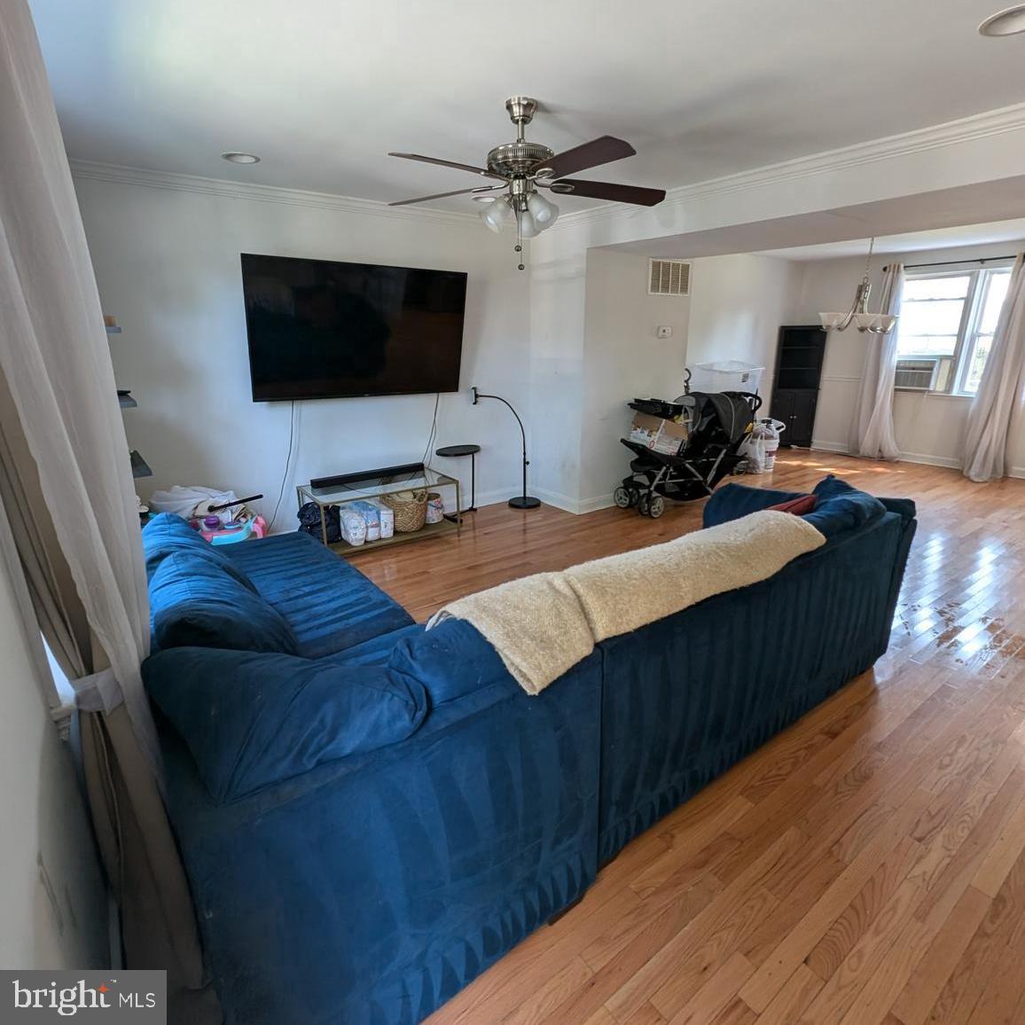 4219 Colborne Road Baltimore, MD 21229 - Photo 4 of 22 a bedroom with bed tv and window