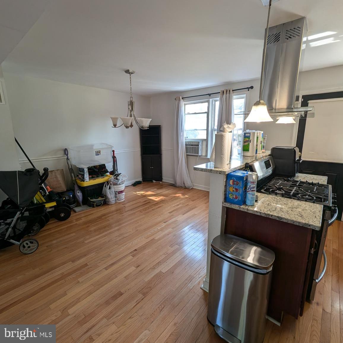 4219 Colborne Road Baltimore, MD 21229 - Photo 7 of 22 a living room with furniture and a wooden floor