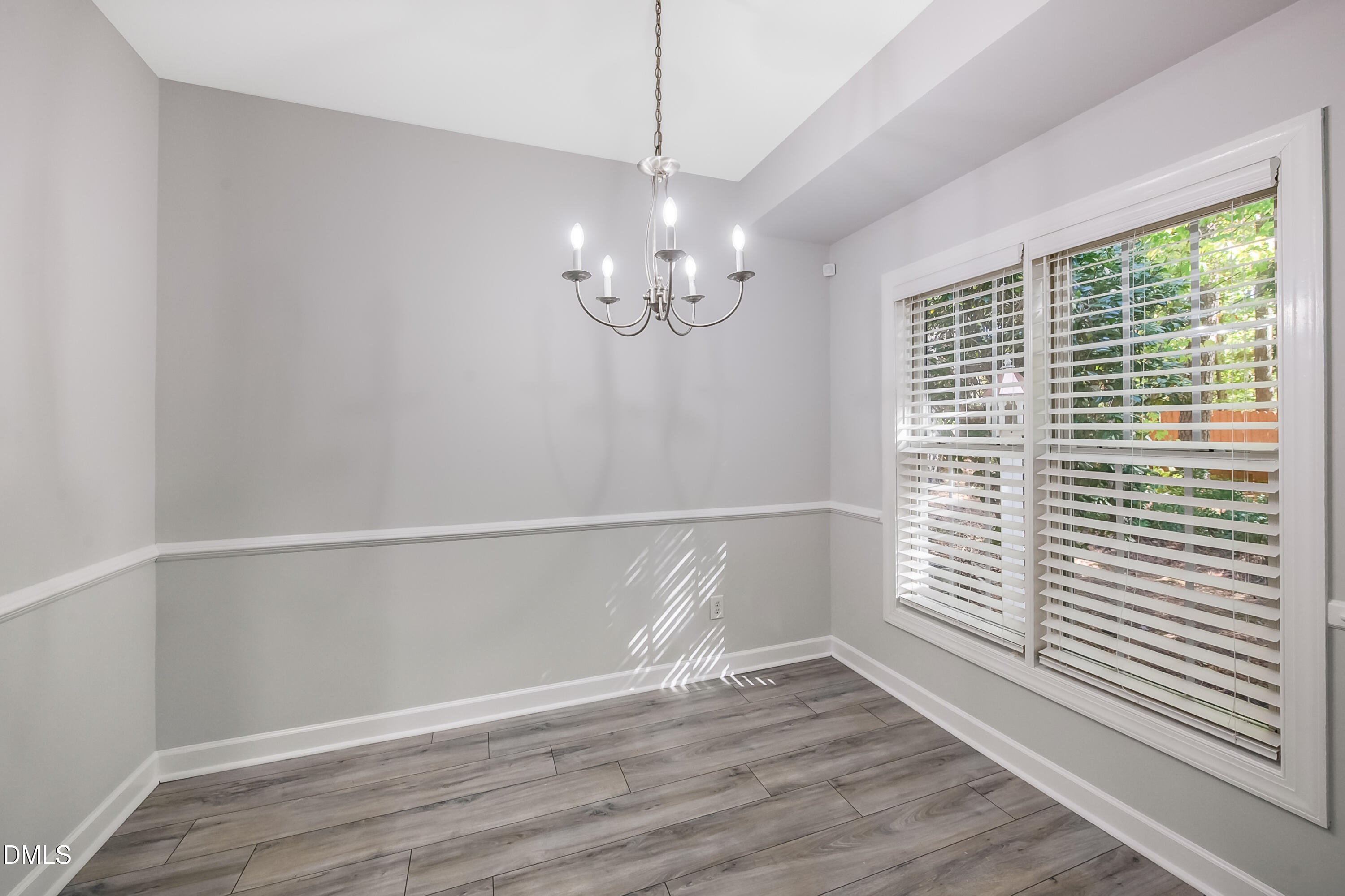 2639 Broad Oaks Place Raleigh, NC 27603 - Photo 15 of 24 a view of an empty room with wooden floor and a window