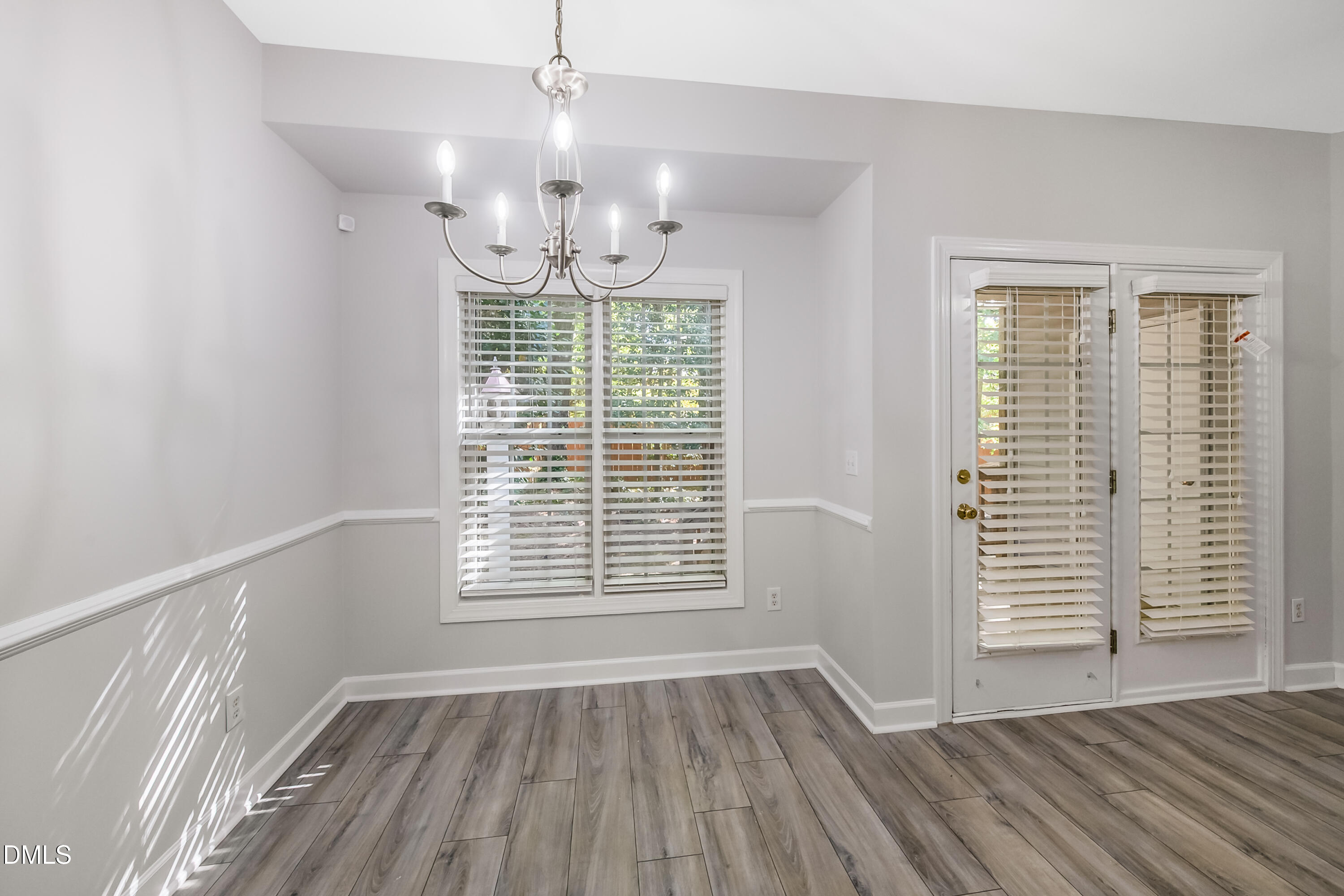 2639 Broad Oaks Place Raleigh, NC 27603 - Photo 16 of 24 a view of an empty room with wooden floor and a window