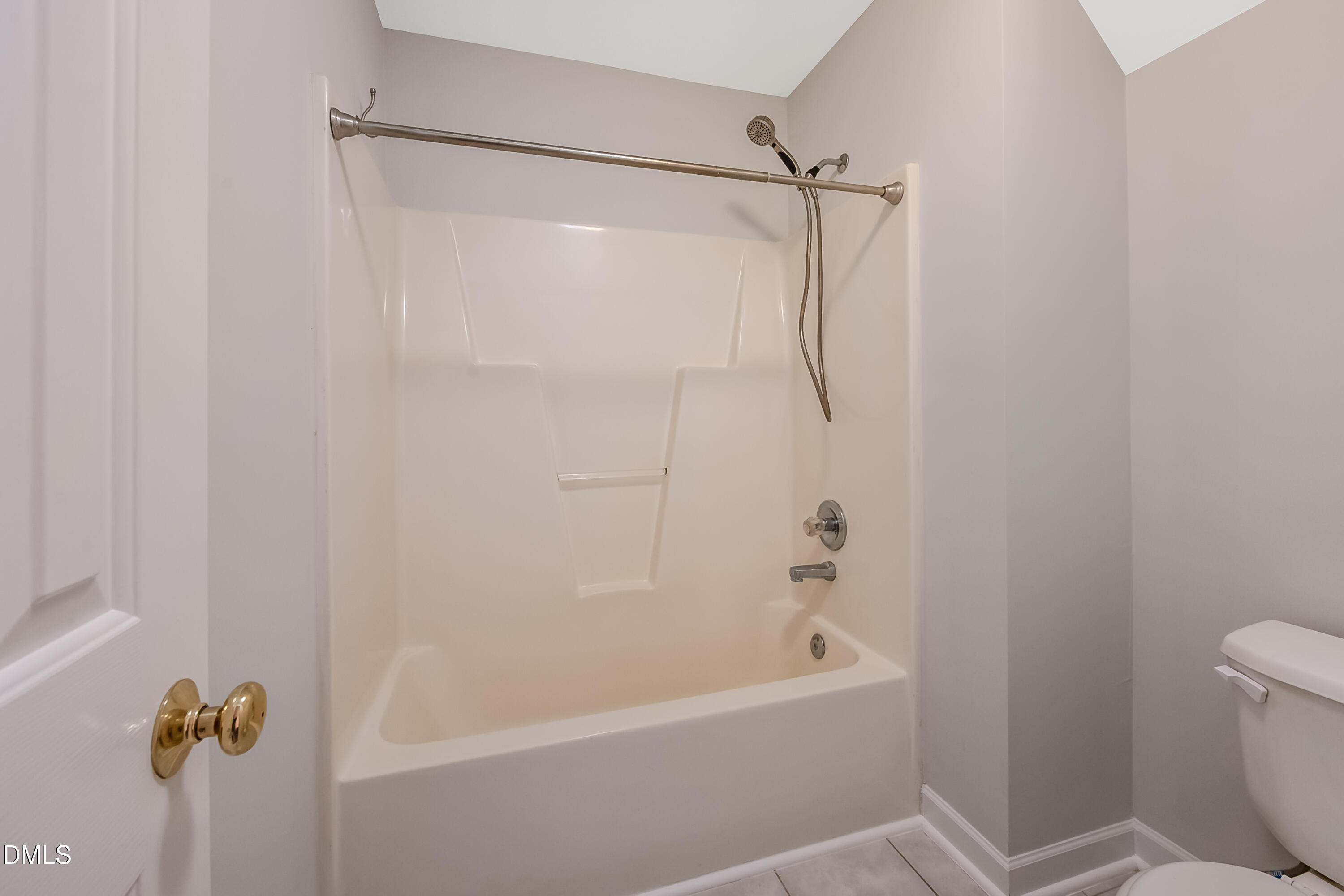 2639 Broad Oaks Place Raleigh, NC 27603 - Photo 20 of 24 a bathroom with a shower and a toilet