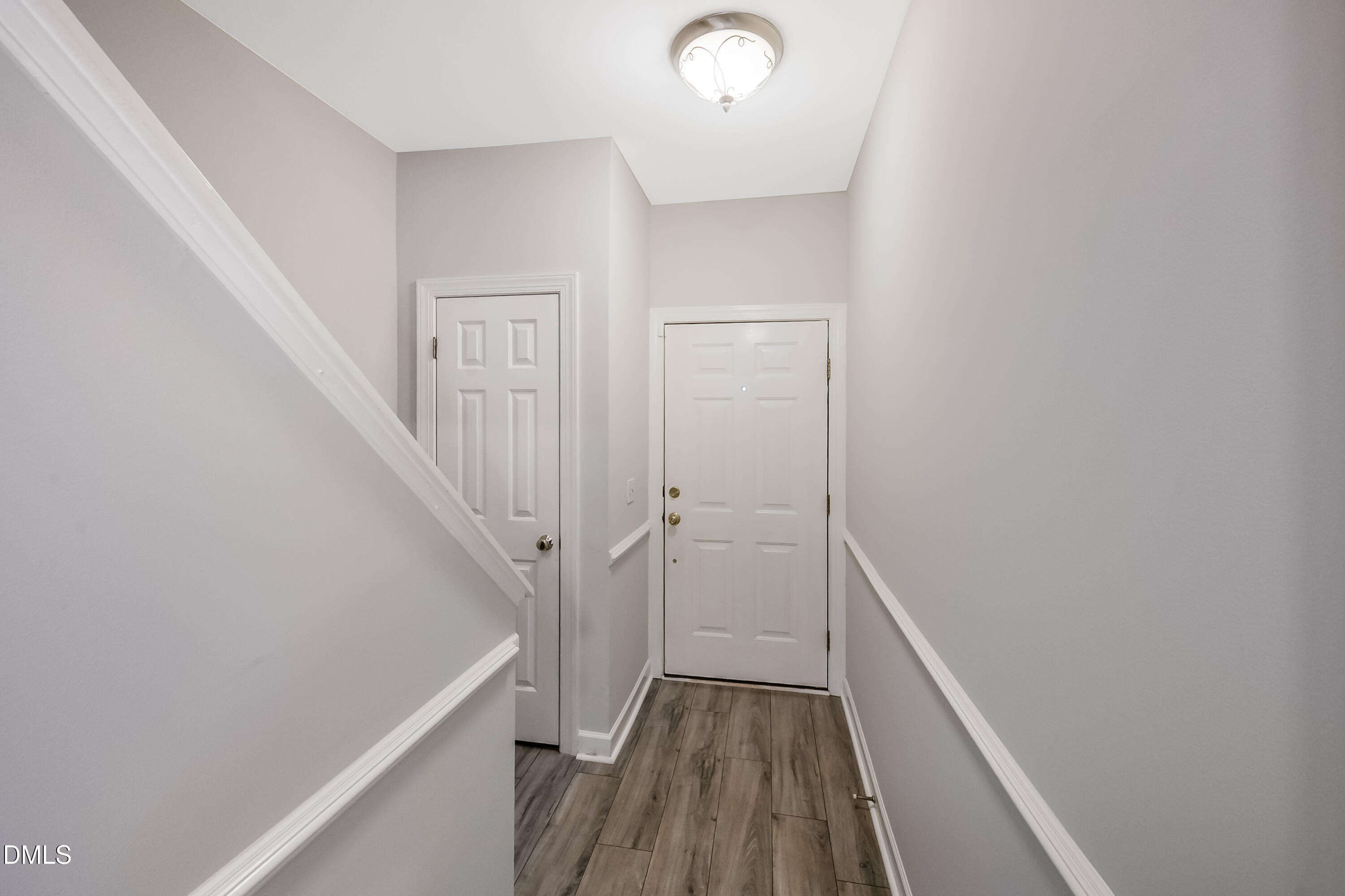 2639 Broad Oaks Place Raleigh, NC 27603 - Photo 3 of 24 a view of a hallway with wooden floor and staircase