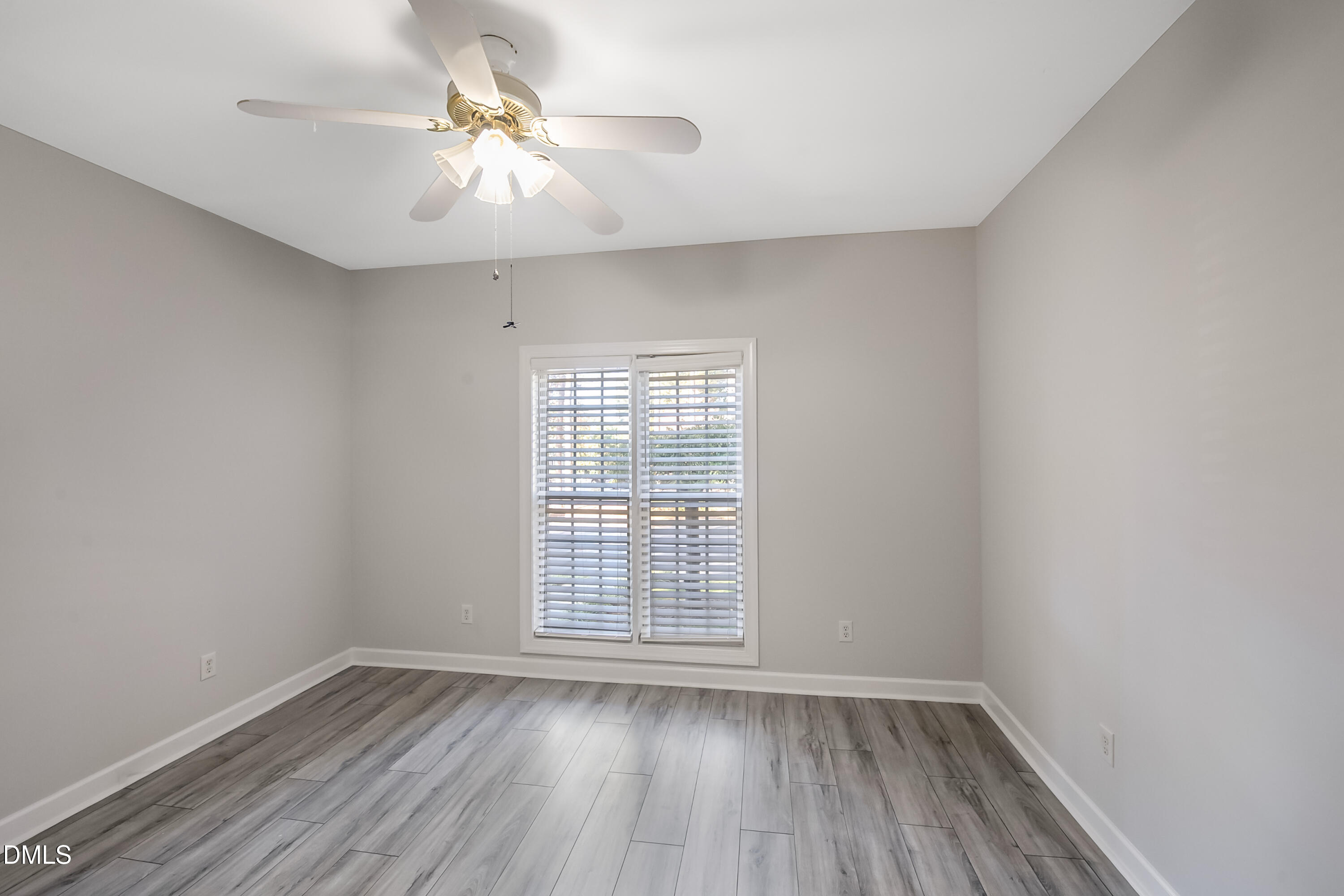 2639 Broad Oaks Place Raleigh, NC 27603 - Photo 4 of 24 wooden floor in an empty room with a window