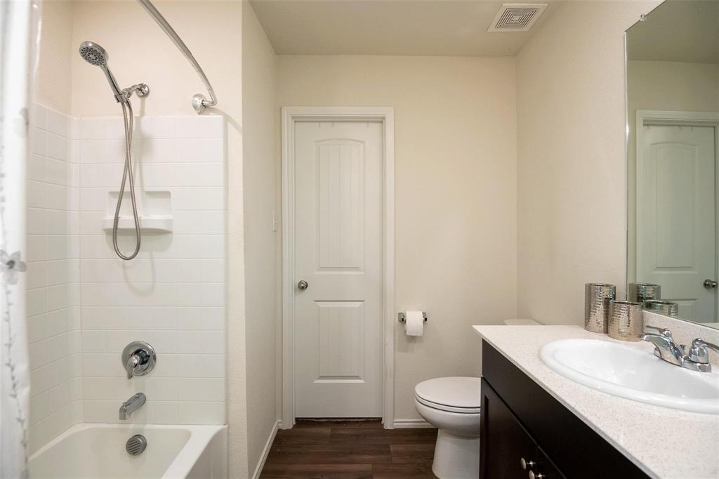 1215 Fairford Road Crandall, TX 75114 - Photo 9 of 17 a bathroom with a sink toilet and shower
