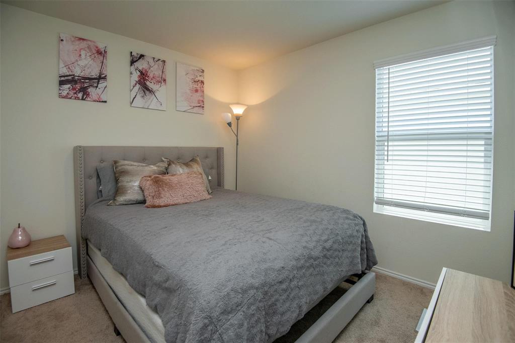 1215 Fairford Road Crandall, TX 75114 - Photo 10 of 17 a bedroom with a bed and a window