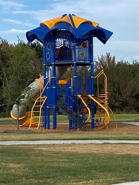 1215 Fairford Road Crandall, TX 75114 - Photo 15 of 17 a view of a house with a yard and a slide