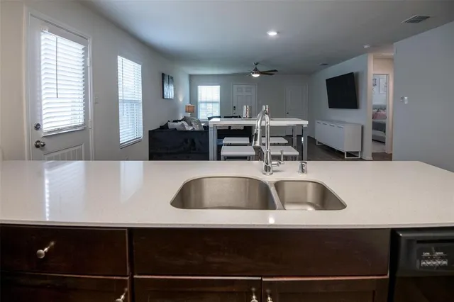 a view of a house with a yard and a slide