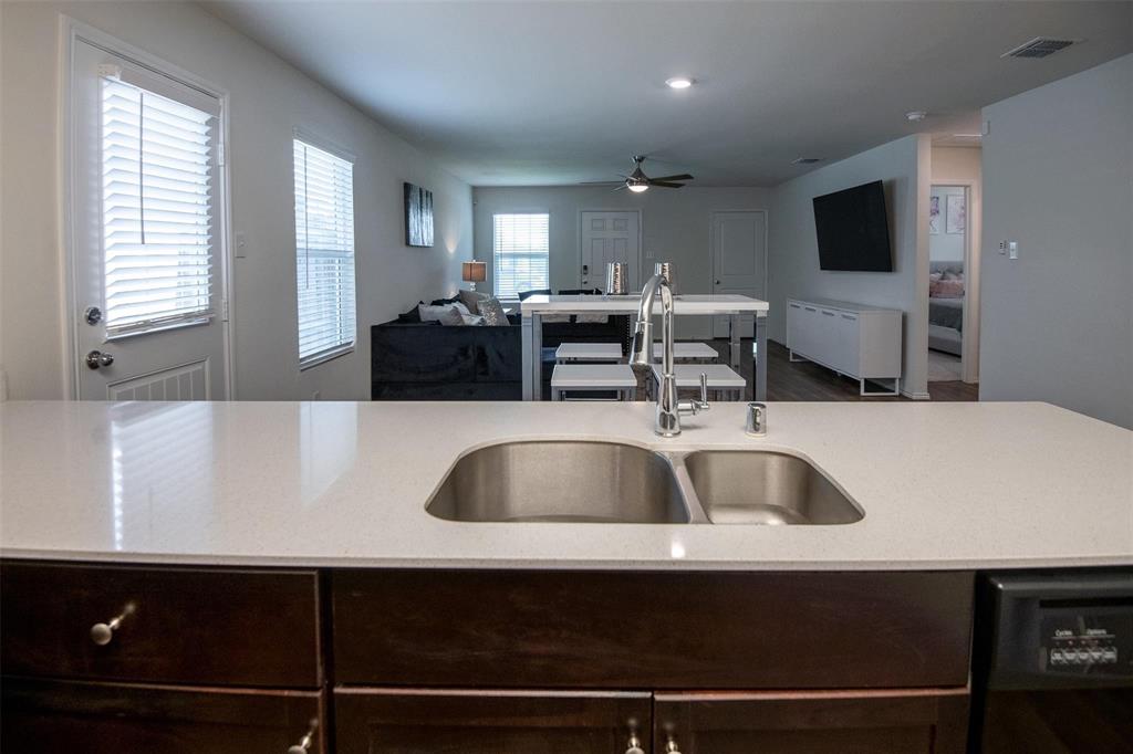 1215 Fairford Road Crandall, TX 75114 - Photo 17 of 17 a kitchen with a sink a microwave and cabinets