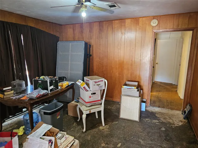 a room with furniture a rug and a window
