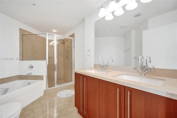 a bathroom with a bathtub and a shower