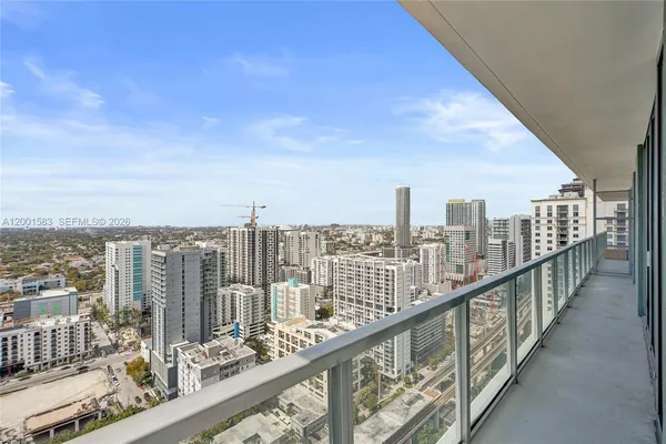 a view of a city skyline from a balcony