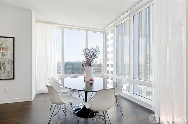 a dining room with furniture window wooden floor