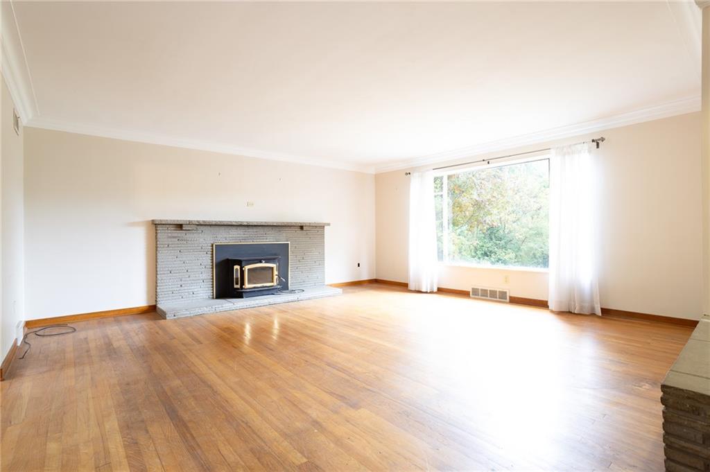 497 Ross Road Eighty Four, PA 15330 - Photo 12 of 35 a view of an empty room with a window and fireplace