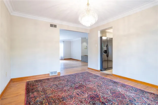 a view of a big room with wooden floor and closet