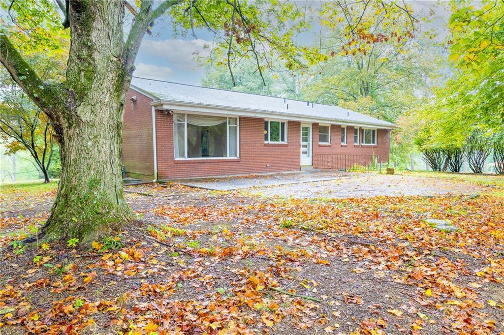 497 Ross Road Eighty Four, PA 15330 - Photo 2 of 35 a front view of a house with garden