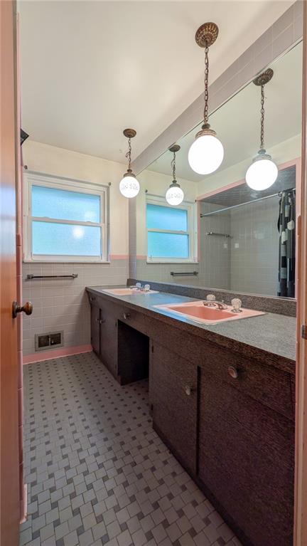 497 Ross Road Eighty Four, PA 15330 - Photo 24 of 35 a bathroom with a sink a large mirror and a light fixture