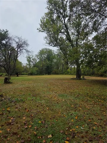 a view of outdoor space with deck and yard