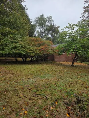 a view of a yard with an outdoor space