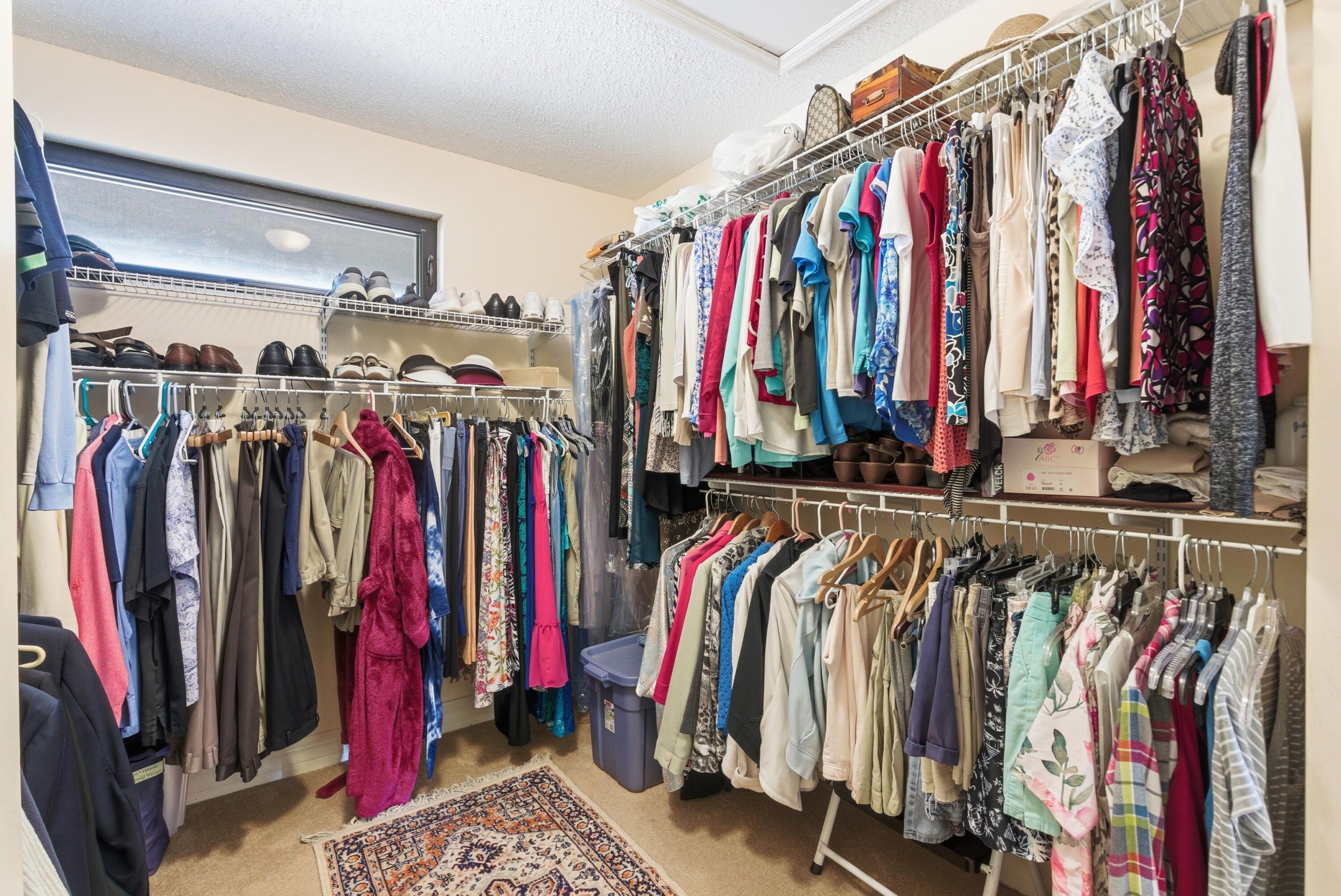 5081 Southeast Burning Tree Circle Stuart, FL 34997 - Photo 30 of 72 a view of walk in closet with clothes