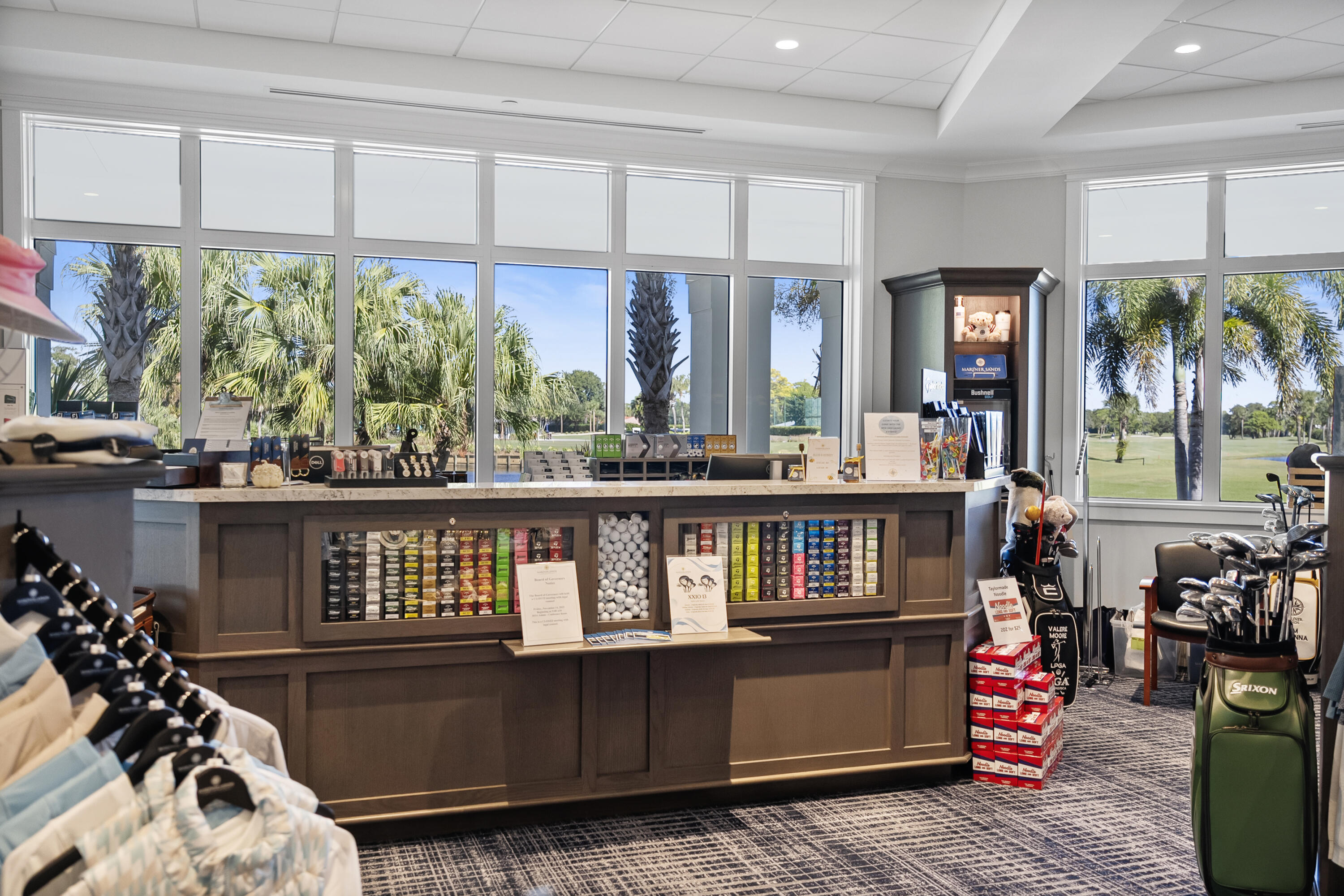 5081 Southeast Burning Tree Circle Stuart, FL 34997 - Photo 66 of 72 an open kitchen with stainless steel appliances kitchen island granite countertop a table chairs in it and wooden floors