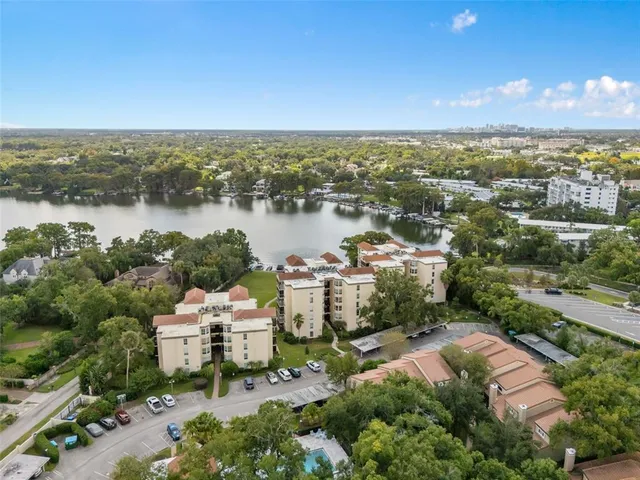 an aerial view of a house with lake view