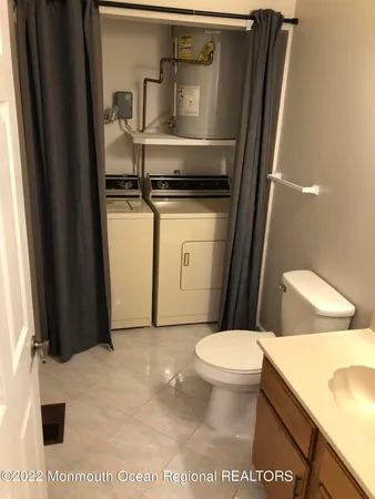 a bathroom with a toilet and a sink