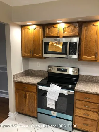 a kitchen with a stove and a microwave