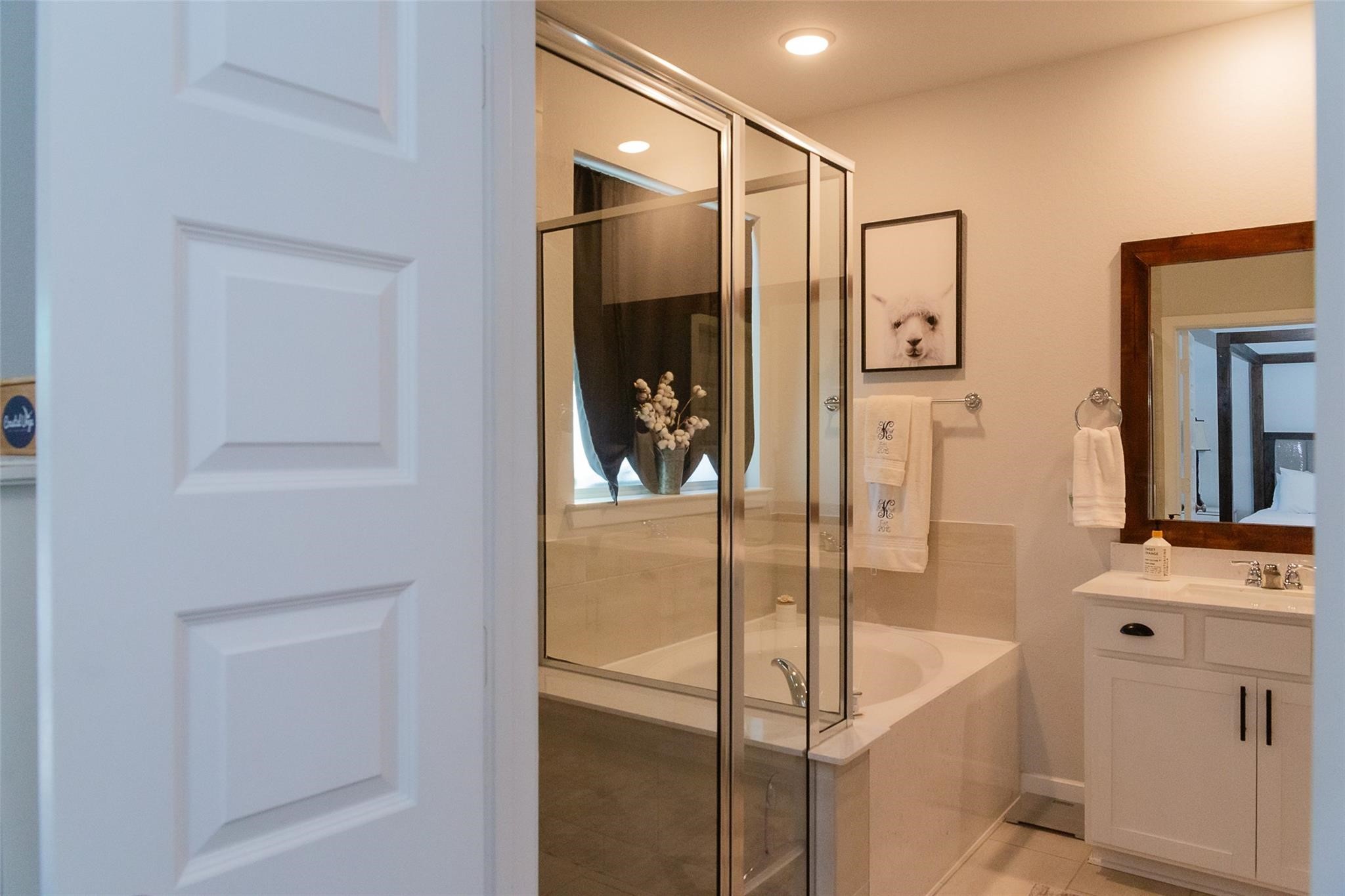 385 Weimer Lagoon Road La Porte, TX 77571 - Photo 11 of 22 a bathroom with a bathtub and a shower