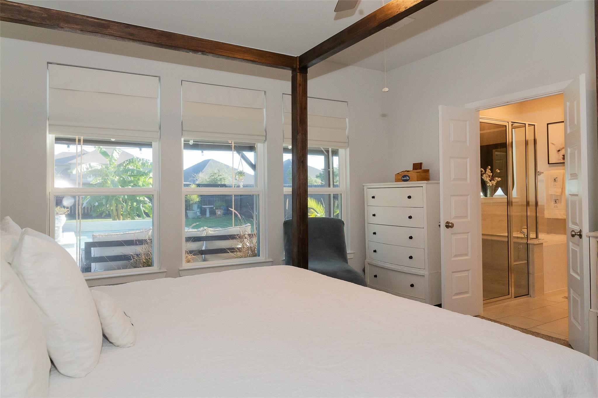 385 Weimer Lagoon Road La Porte, TX 77571 - Photo 10 of 22 a bedroom with a bed and a large window