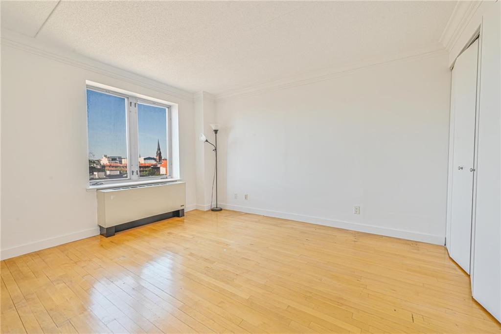 53 Boerum Place, Unit 7C Brooklyn, NY 11201 - Photo 3 of 7 a view of an empty room with wooden floor