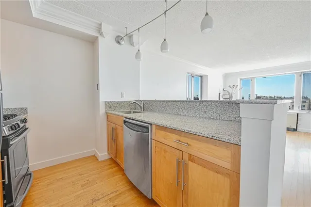 a view of a kitchen with a sink and dishwasher