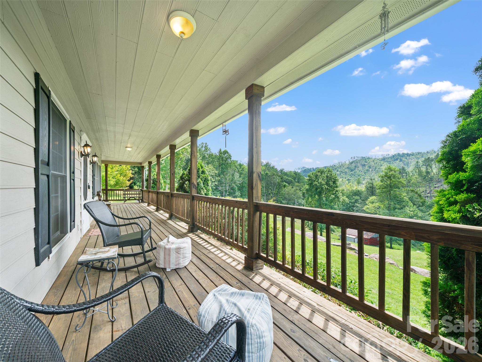 2216 Beans Creek Road Bakersville, NC 28705 - Photo 2 of 39 a balcony with chairs