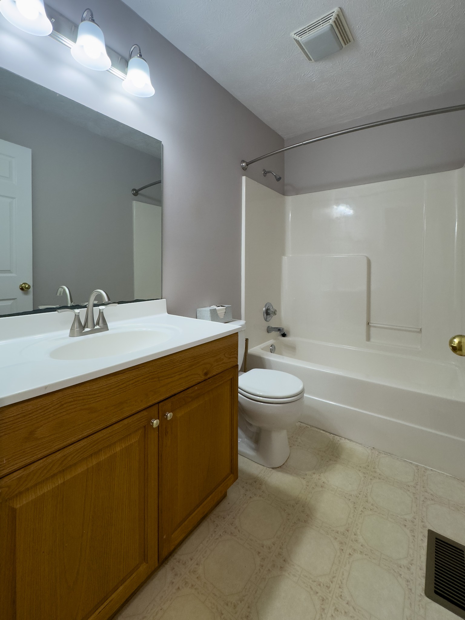 618 Lear Road Portland, TN 37148 - Photo 22 of 29 a bathroom with a double vanity sink toilet and shower