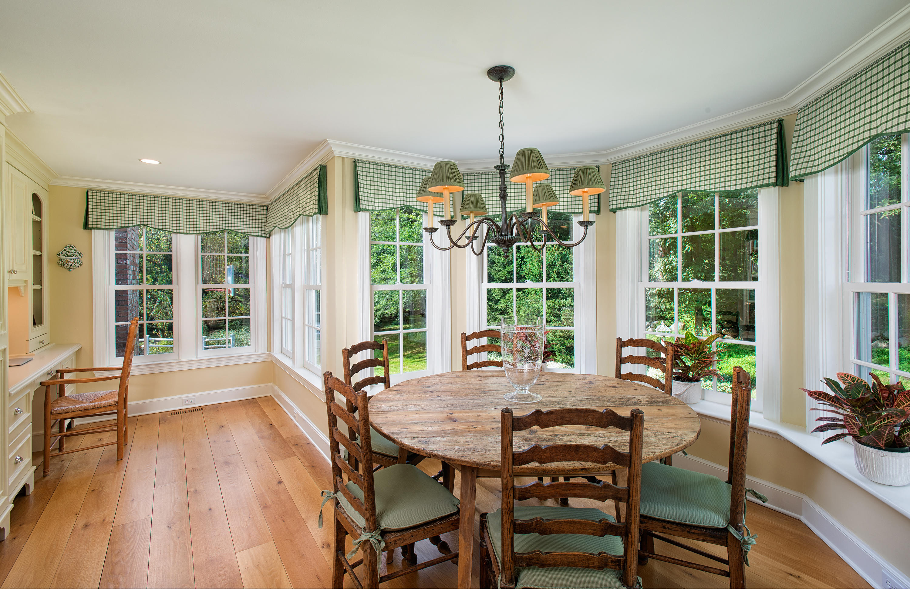 249 Nod Hill Road Wilton, CT 06897 - Photo 13 of 35 a view of a dining room with furniture window and wooden floor