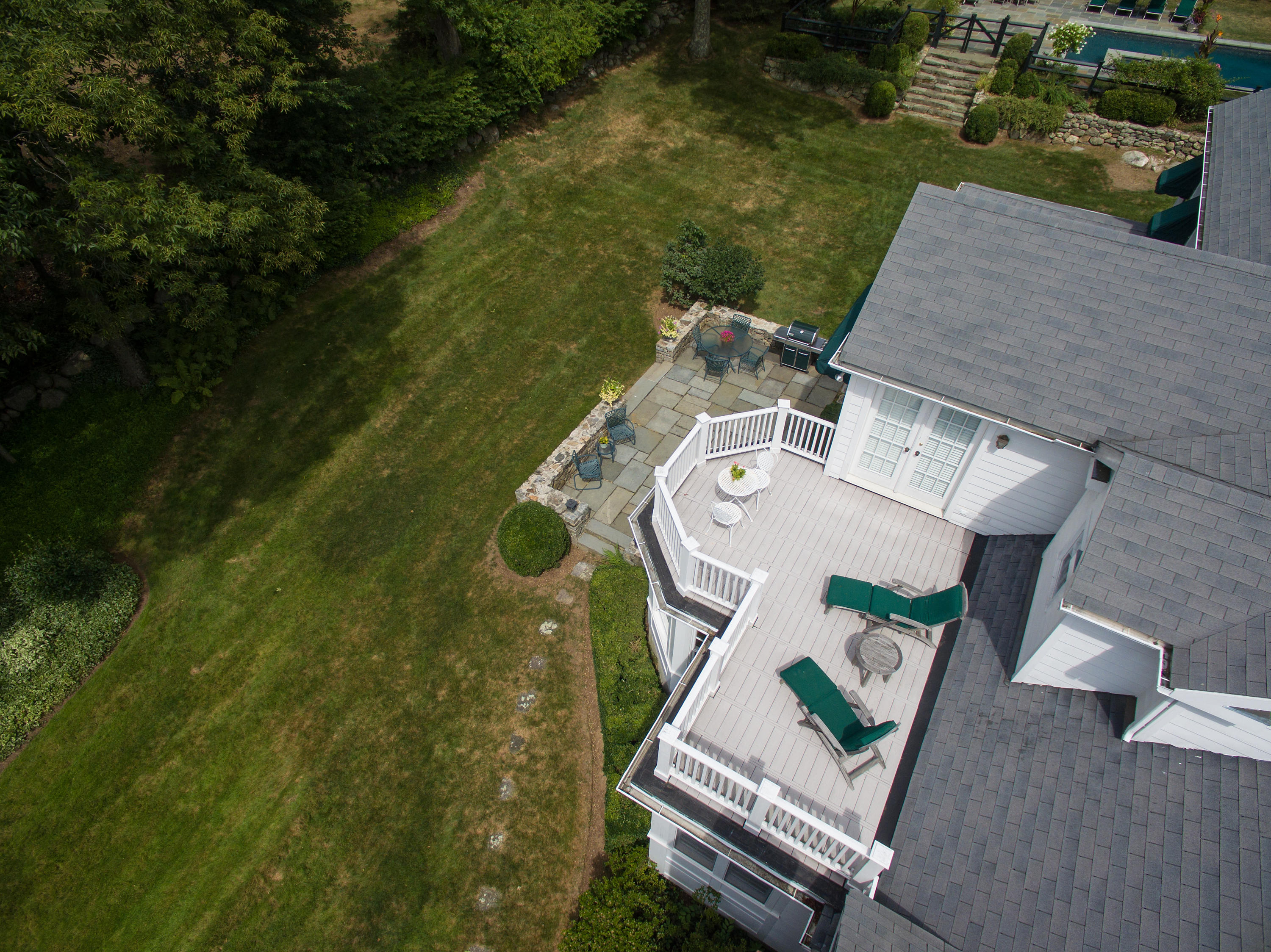 249 Nod Hill Road Wilton, CT 06897 - Photo 20 of 35 an aerial view of a house with a garden and lake view