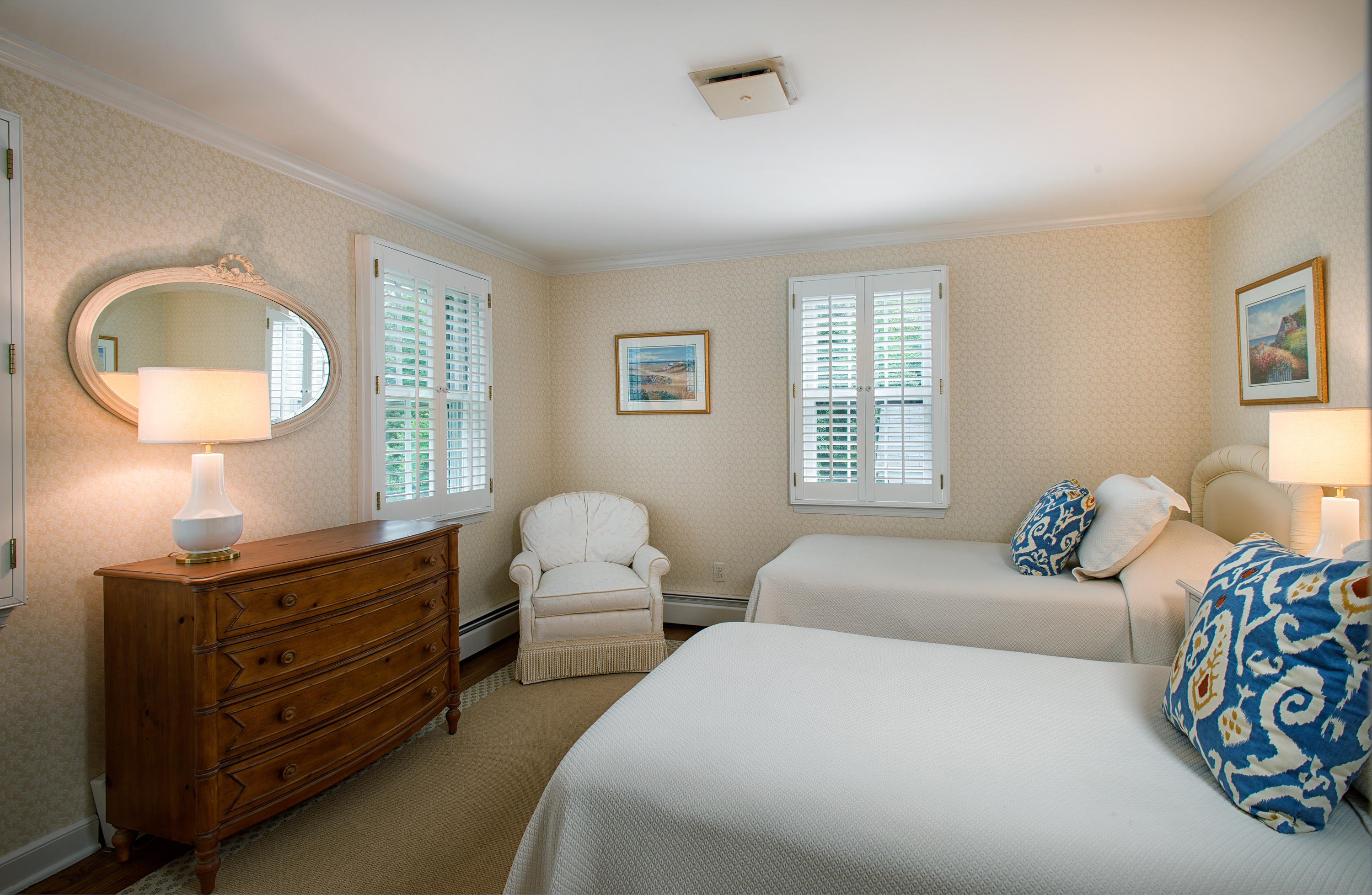 249 Nod Hill Road Wilton, CT 06897 - Photo 21 of 35 a bedroom with two beds and a dresser with mirror